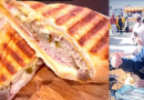 Boxeador cubano Valodia Carrero sirviendo un sándwich cubano en su food truck en Japón.